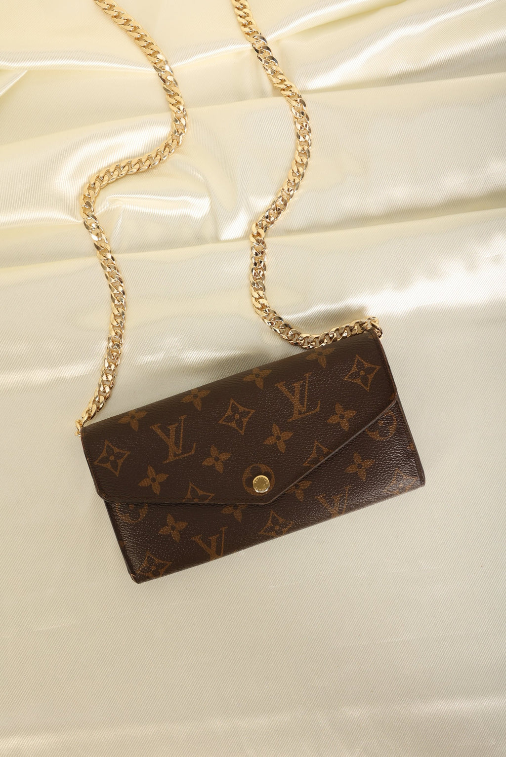 lv book chain wallet review