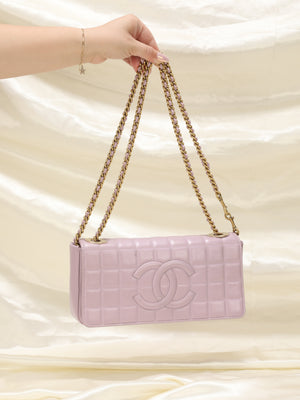 CHANEL EAST WEST FLAP BAG, with quilted 'chocolate bar' design pink canvas,  silver plated hardware, shoulder chain interwoven with leather, fabric  lining, authenticity card and inside sticker 2000-2002, 26cm x 13cm H.