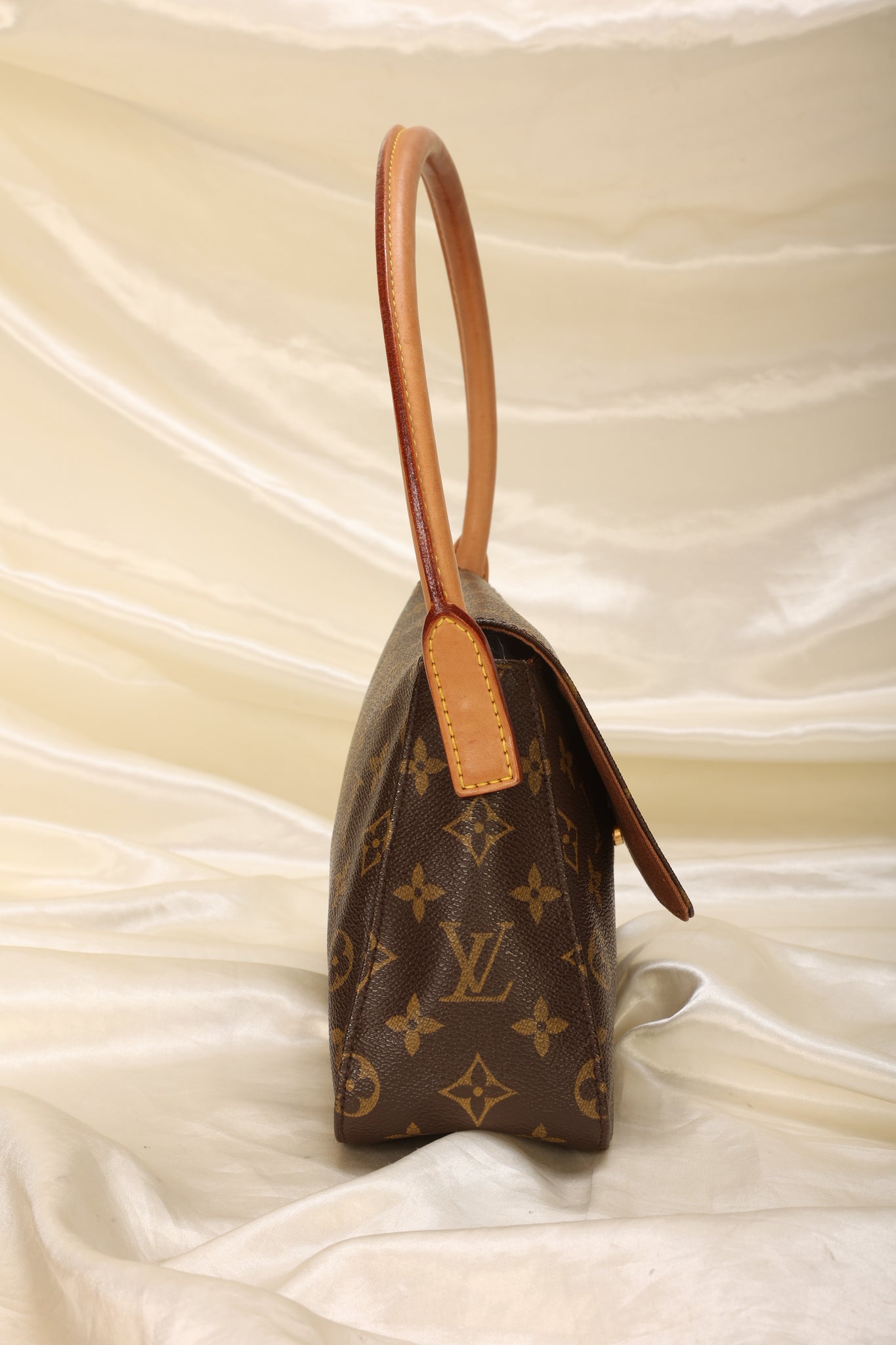 This vintage Louis Vuitton monogram mini looping bag