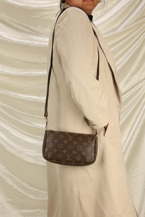 Louis Vuitton Pochette with crossbody strap.