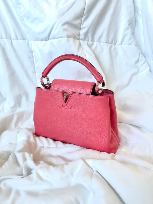 A WICKER AND PINK LEATHER CAPUCINES BAG WITH SILVER HARDWARE