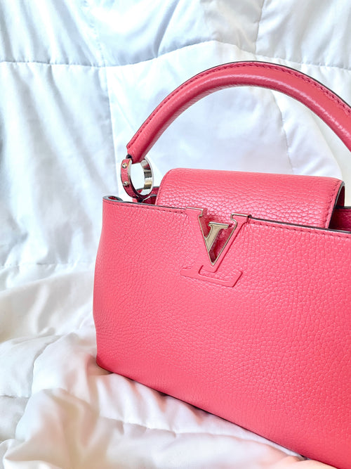 A WICKER AND PINK LEATHER CAPUCINES BAG WITH SILVER HARDWARE